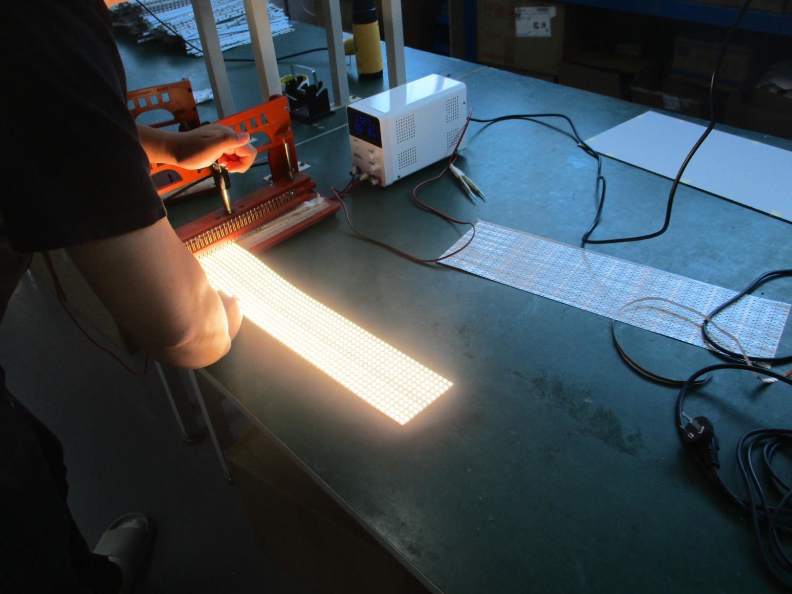Operator performing an LED light-up inspection